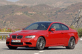 BMW M3 coupé rouge 3/4 avant gauche