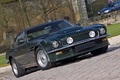 Aston Martin V8 Vantage vert 3/4 avant droit penché