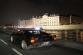 Ferrari Testarossa noir 3/4 arrière gauche travelling