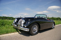 Jaguar XK150 Roadster noir route Arpajon 3/4 avant gauche