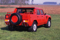 Lamborghini LM002 rouge 3/4 arirère droit statique