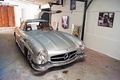 Mercedes 300 SL gris 3/4 avant droit porte ouverte atelier CSL