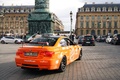 BMW M3 GTS orange 3/4 arrière droit filé