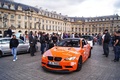 BMW M3 GTS orange 3/4 avant gauche filé
