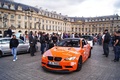 BMW M3 GTS orange 3/4 avant gauche filé