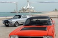 Plymouth GTX face+ Ford Mustang gris 3-4 avg+pdc