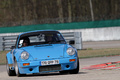 Porsche 911 Carrera bleu 3/4 avant droit penché