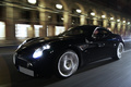 Alfa Romeo 8C Competizione noir rue de Rivoli 3/4 avant gauche travelling