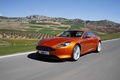 Aston Martin Virage orange 3/4 avant gauche travelling