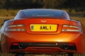 Aston Martin Virage orange face arrière coupé