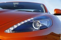 Aston Martin Virage orange phare avant
