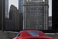 Audi e-Tron rouge face arrière debout