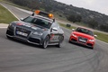 Audi RS5 anthracite pace car 3/4 avant gauche & rouge face avant travelling penché