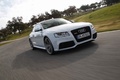 Audi RS5 blanc 3/4 avant droit travelling penché