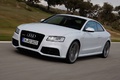 Audi RS5 blanc 3/4 avant gauche travelling penché