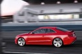 Audi RS5 rouge 3/4 arrière gauche travelling penché