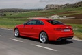 Audi RS5 rouge 3/4 arrière gauche travelling