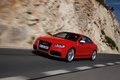 Audi RS5 rouge 3/4 avant gauche travelling penché 5