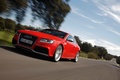 Audi RS5 rouge 3/4 avant gauche travelling penché 6