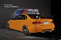 BMW M3 GTS - orange - 3/4 arrière gauche