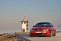 BMW M3 rouge 3/4 avant gauche