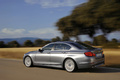 BMW Série 5 2010 - grise - 3/4 arrière gauche, dynamique