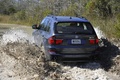 BMW X5 2010 gris 3/4 arrière boue