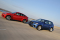 BMW X5 M bleu & X6 M rouge 3/4 avant gauche travelling penché
