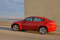 BMW X6 M rouge profil travelling