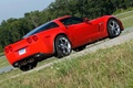 Chevrolet Corvette C6 Grand Sport rouge 3/4 arrière droit penché