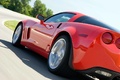 Chevrolet Corvette C6 Grand Sport rouge 3/4 arrière gauche travelling penché coupé