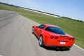 Chevrolet Corvette C6 Grand Sport rouge 3/4 arrière gauche travelling penché vue de haut