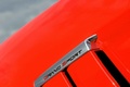 Chevrolet Corvette C6 Grand Sport rouge logo aile debout