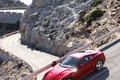 Ferrari 599 HGTE rouge 3/4 avant gauche filé debout