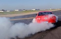 Ford Mustang GT rouge face arrière penché burn