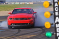 Ford Mustang GT rouge face avant penché burn