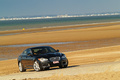 Jaguar XFR noire plage 3/4 avant droit