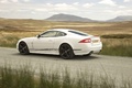 Jaguar XKR blanc 3/4 arrière gauche filé