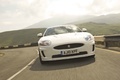 Jaguar XKR blanc face avant travelling penché