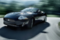 Jaguar XKR Cabriolet noir 3/4 avant gauche travelling