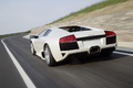 Lamborghini Murcielago LP640 blanc 3/4 arrière gauche travelling penché