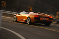 Lamborghini Murcielago LP640 Roadster orange 3/4 arrière gauche filé penché