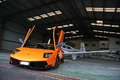 Lamborghini Murcielago LP670-4 SV orange face avant avion