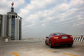 Maserati GranTurismo S rouge 3/4 arrière gauche penché