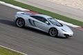 McLaren MP4-12C gris 3/4 avant droit filé vue de haut penché