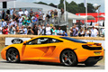 McLaren MP4-12C orange Goodwood 3/4 arrière gauche filé 2