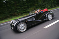 Morgan Aero 8 noir autoroute 3/4 avant gauche travelling penché