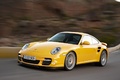 Porsche 911 Turbo 2009 - jaune - 3/4 avant gauche dynamique