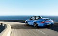 Porsche 997 Carrera 4 GTS - Cabriolet bleu - 3/4 arrière gauche, dynamique