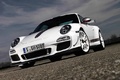 Porsche 997 GT3 RS 4.0 blanc 3/4 avant gauche penché debout